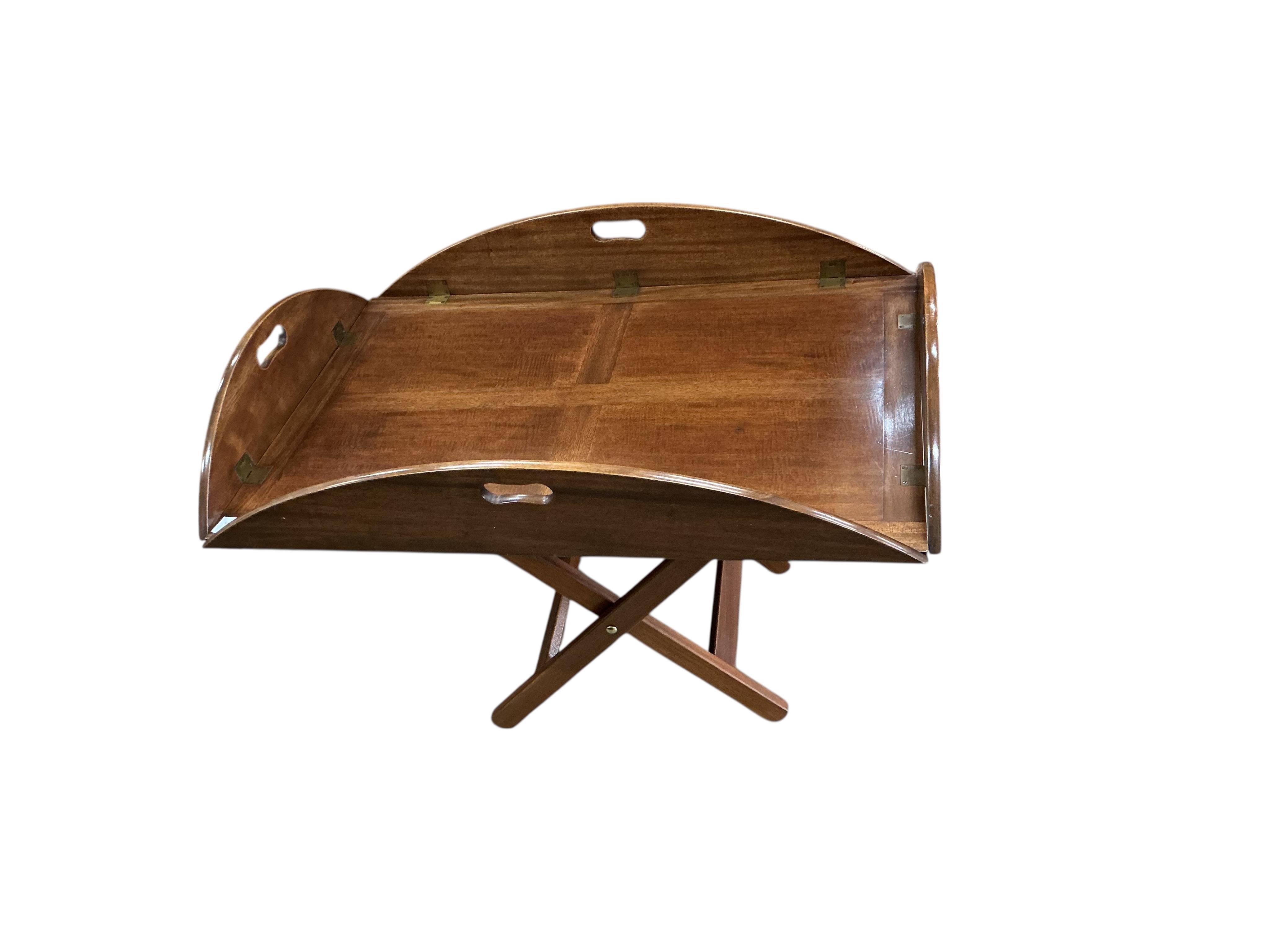 A reproduction George III style mahogany butler's tray / occasional table on folding stand, width 94cm, depth 64cm, height 65cm